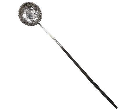 A Georgian silver punch ladle with baleen handle and silver terminal, the bowl set with a Queen Anne sixpence dated 1711 and 