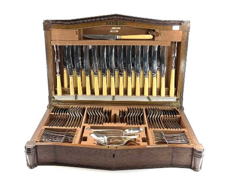 A 1930's large oak canteen containing a set of silver plated Hanovarian Rat-Tail pattern cutlery for 12 by Finnigans Ltd Manc