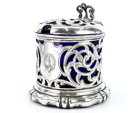An early Victorian silver mustard pot by Henry Wilkinson, of cylindrical form with foliate scroll, engraved and pierced decor