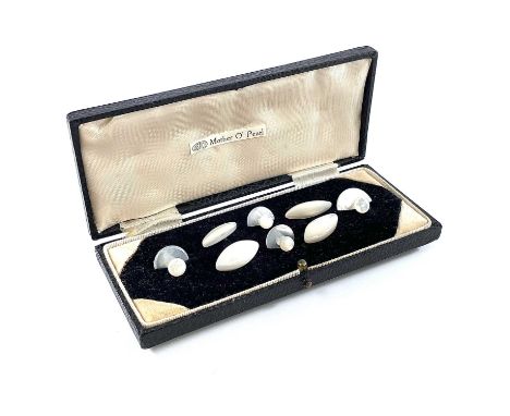 A cased set of mother of pearl cufflinks and shirt studs.