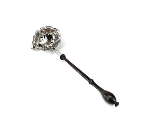 A George II silver punch ladle, possibly by Phillips Garden, with serpentine shaped bowl and turned wood handle, London 1743,