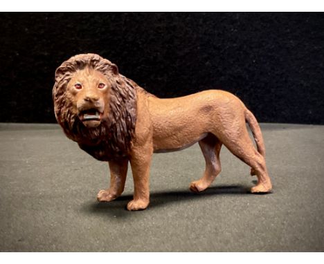 After Bergmann, a cold painted metal model, Standing Lion, 9.5cm long. 