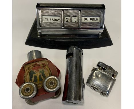 A mid 20th century German Gesch/Baier novelty table lighter, the hexagonal red body with remnants of original playing card de