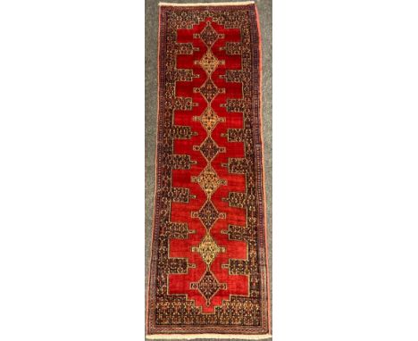 A North West Persian Senneh runner carpet, 255cm x 78cm. 