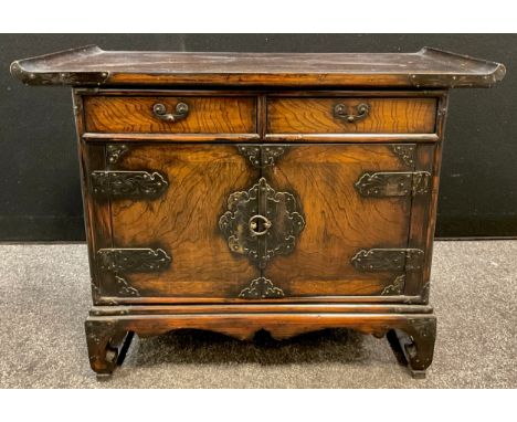 A Chinese elm and hardwood side cabinet / altar table, pair of short drawers to frieze, cupboard doors with strap hinges, bra