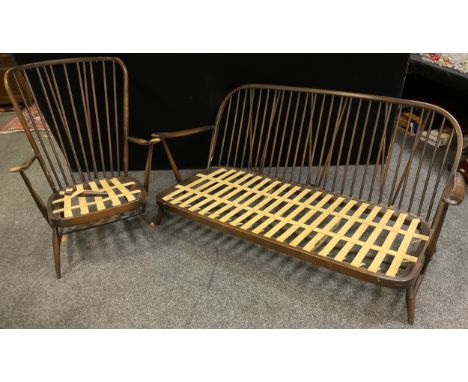 An Ercol three seat sofa, 81cm high x 177cm wide x 90cm deep; conforming armchair, (2). 