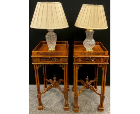 A pair of Chinoiserie Chippendale style lamp tables, pierced galleried top, and frieze, turned Bamboo effect supports, x-fram