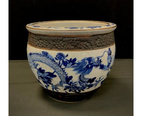 A Chinese blue and white crackled planter, 22cm high, 27cm diameter. 