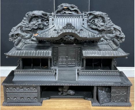 A Chinese ebonised architectural pagoda-form table-top cabinet, 88.5cm high, 114cm wide, 33cm deep 