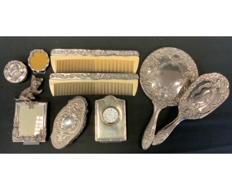 A Concorde silver travel clock, R Carr, Sheffield 1995;  silver topped cut glass Dressing table tidy, Chester 1903;  silver p