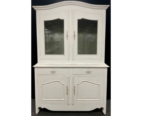 A French style ‘Buffet deux corps’, serpentine shaped top, pair of glazed doors, above a base with two drawers, and two cupbo