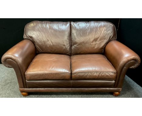 A bespoke made Italian tan leather two seat sofa, 98cm high x 182cm wide x 99cm deep. 