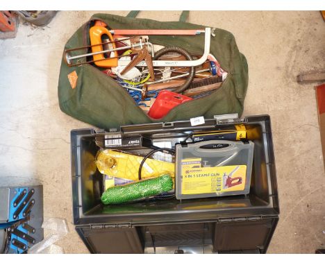 A green canvas bag of tools and a plastic toolbox and contents.
