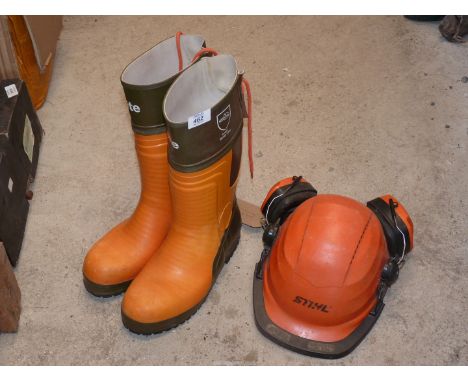A "Stihl" chainsaw hat and ear defenders and a pair of size 8 safety boots.