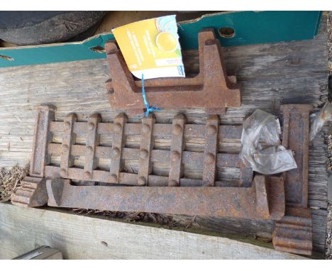 A cast iron fire grate.