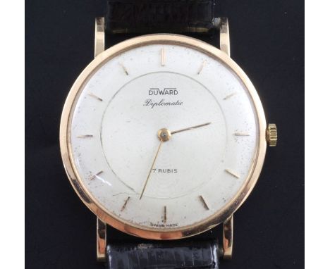 A gentleman's 18ct gold Duward Diplomatic manual wind dress wrist watch, with baton numerals, on later associated strap.