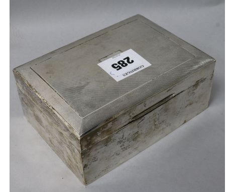 A 1960's engine turned silver cigarette box, 6.25in.