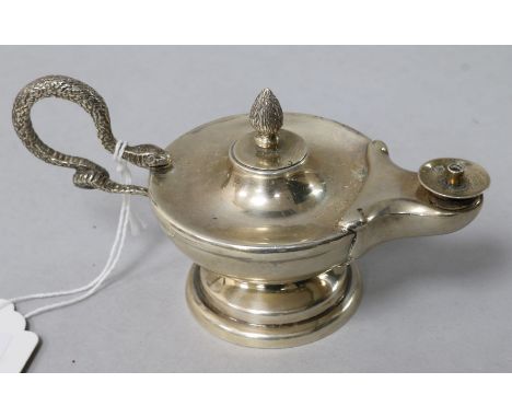An early 20th century silver club lighter, modelled as an oil lamp with serpent handle.