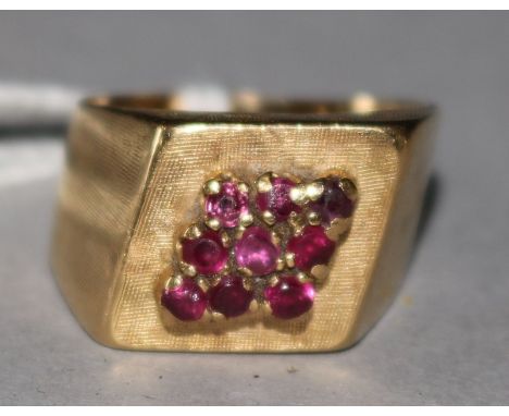 An 18ct gold and ruby cluster cocktail ring, size K.