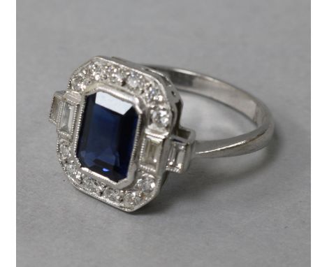 A modern Art Deco style 18ct white gold, sapphire and diamond cluster octagonal ring, size M.