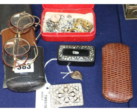 A memorial brooch with hairpiece, various paste-set clips and brooches, wire-rimmed and folding spectacles, papier mache snuf