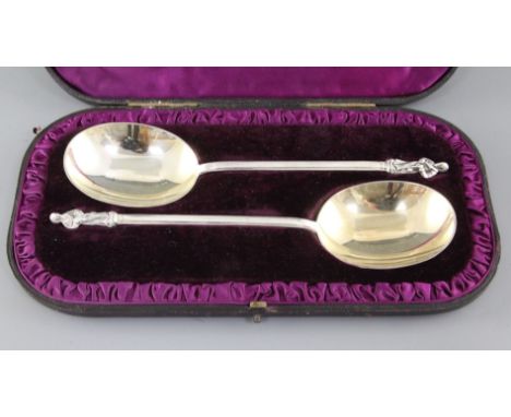 A cased pair of Victorian silver apostle spoons, with hexagonal stems and gilded bowls, Edward Hutton, London, 1884, 8.25in, 