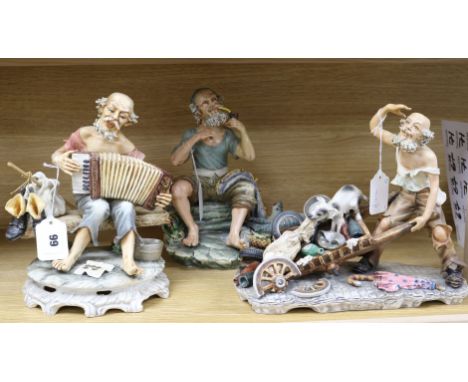 Three large Capodimonte figures signed Mollica, including a seated fisherman with pipe and catch, a seated tramp playing an a