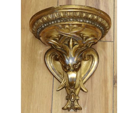 A 19th century carved giltwood and gesso wall bracket with label John Lane, Knightsbridge