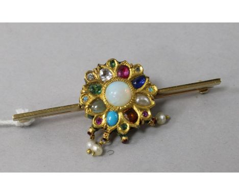 An Indian gold, enamel and multi gem set bar brooch, including white opal, garnet and sapphire, (converted?), 2.25in.