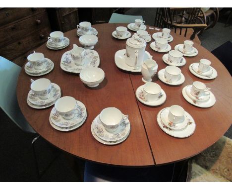 A Coalport 'Camelot' part tea service and quantity of plum decorated tea wares