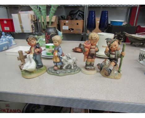 Three Goebel figures including girl with lambs and a foreign example (4)