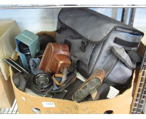 A box of photographic items including Praktica camera, light meters etc.