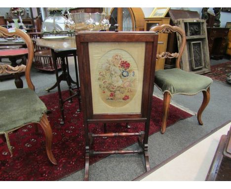 A Victorian walnut glazed fire screen with wool-work tapestry of floral spray design