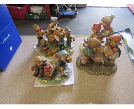 A Goebel figure of children skiing, Goebel "Special Delivery", Hummel "Autumn Arrival" with certificate and Hummel "Happy Har