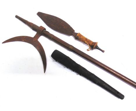AN IRISH BOG OAK ANGLER'S PRIEST OR SMALL CLUB  the flat head carved with a shamrock, 31.5cm long; together with a spear head