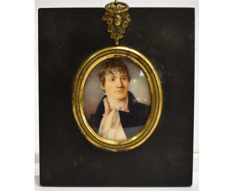 A 19TH CENTURY OVAL PORTRAIT MINIATURE  of a young gentleman, watercolour/gouache on ivory, in ebonised papier mache frame wi