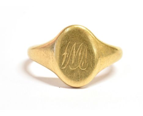 A 18ct GOLD SIGNET RING  with a monogrammed initial cartouche, hallmarked for Birmingham with faded date letter, ring size L 