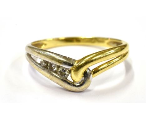 A DIAMOND SET WISHBONE RING On yellow metal with white metal detail, shank marked 18kt, ring size N ½ weight approx. 2.2 gram