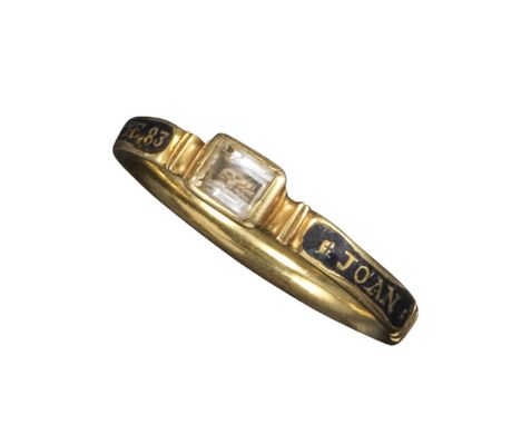 An early 18th-century black enamel mourning ring, set with a skull beneath rock crystal (chipped), the band decorated with bl