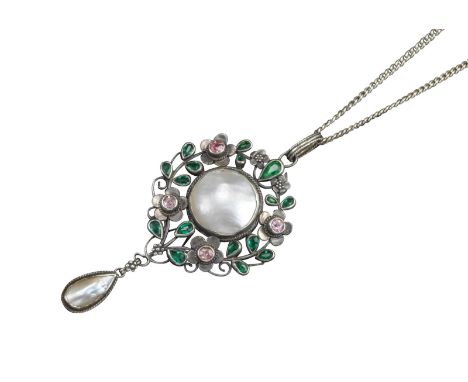 A gem-set silver pendant by Arthur and Georgie Gaskin, the central circular section set with mother-of-pearl surrounded by la