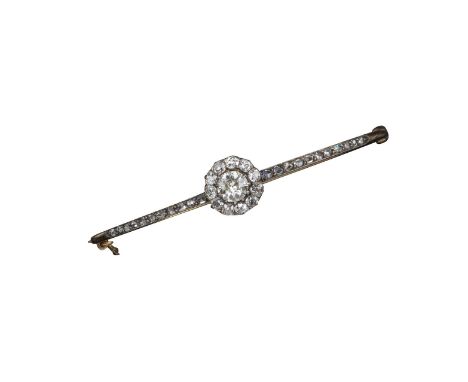 A late Victorian diamond cluster bangle, set in silver and gold, the cluster centred with an old circular-cut diamond within 