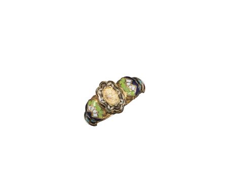 A gold poison ring, the shaped oval centre section hinged to reveal a secret compartment with black and white enamel border, 