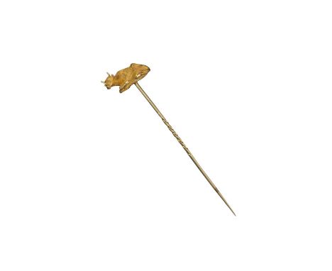 A gold stick pin, mounted with a realistically formed and textured recumbent cow, the cow 2cm long