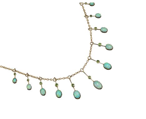 An Edwardian opal and diamond necklace, the graduated white cabochon opals suspended on knife-edge gold links, each set with 
