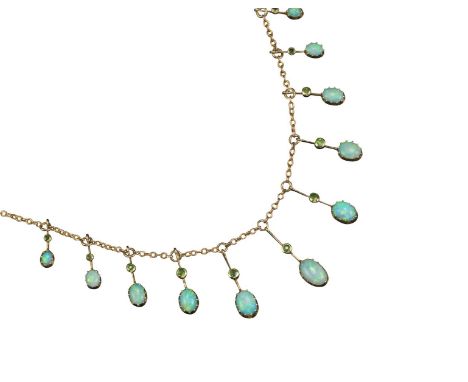 An Edwardian opal and diamond necklace, the graduated white cabochon opals suspended on knife-edge gold links, each set with 