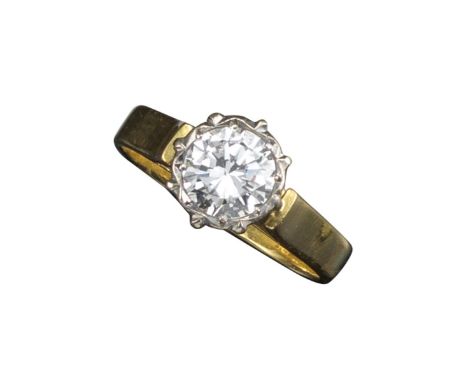 A diamond solitaire ring, the round brilliant-cut diamond weighs approximately 1.05cts and is set in platinum and 18ct yellow