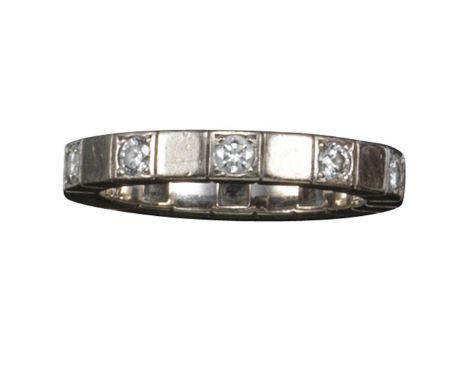 A diamond full-circle eternity ring by Cartier, set with round brilliant-cut diamonds in white gold, signed, size K