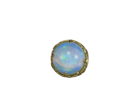 A large opal and enamel ring, the solid cabochon opal claw-set in a matte green enamel mount embellished with scroll and shel