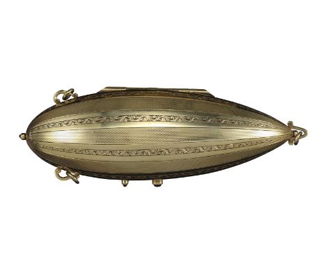 An unusual early 20th-century gold zeppelin-form minaudière, decorated with alternate stripes of engine turned and scroll pan