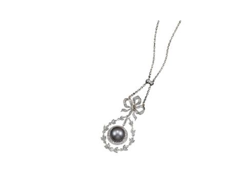 A Belle Йpoque diamond and natural pearl pendant, the pearl millegrain-set within a surround of circular-cut diamonds, suspen